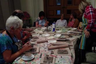Visitors making pottery at the GRaCE cafe