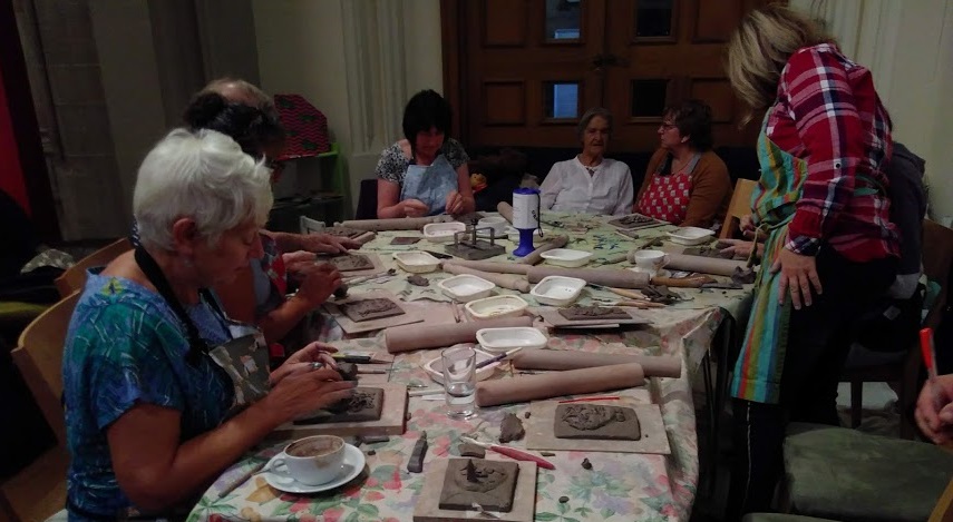 Visitors making pottery at the GRaCE cafe