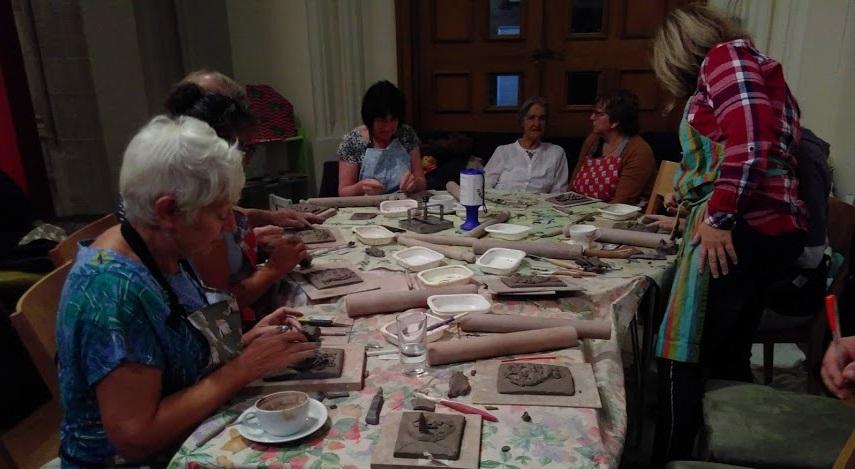 Visitors making pottery at the GRaCE cafe